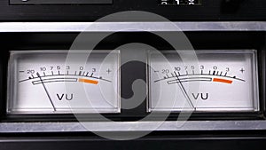 Two old analog dial vu signal indicators with arrow