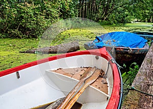 Two old boats in a river