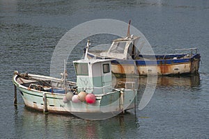 Two old fishing boats in