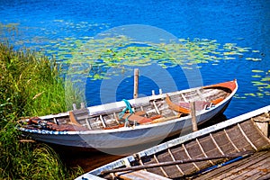 Two old fishing wooden rowboats