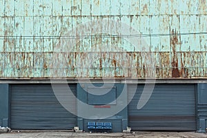 Two old garage doors of a warehouse