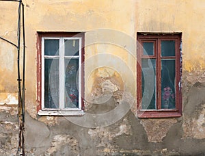 Two old house Windows and a wall