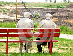 Two old man sitting on the bench