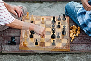 Two old men play chess