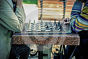 Two old men playing chess. Active retired people, old friends and free time. Active retired people old friends and free