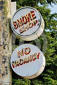 Two Old Metal Painted and Neon Smoke Shop and No Vacancy Signs