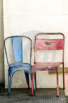 Two old metallic rusty chairs