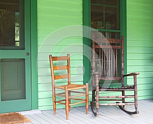 Two old rocking chairs on a porch