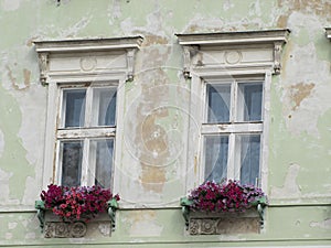 Two old romantic windows in old house