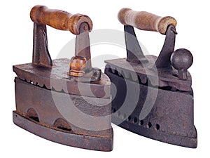 Two old rusty coal irons isolated on white