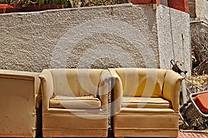 two old sofas left on the street side