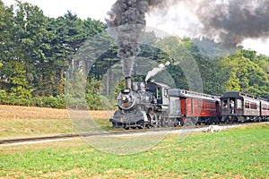 Two old steam trains passing