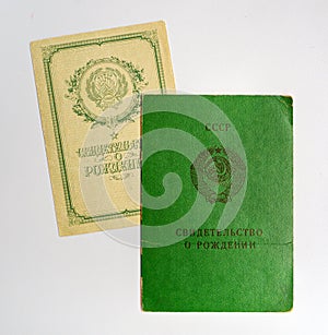 Two old-style birth certificates of a child obtained in the USSR. photo