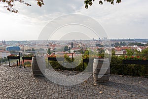 Two old wine barrels and a beautiful view of the Prague skyline