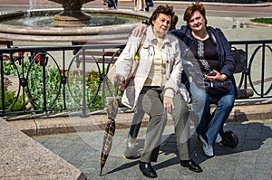 Two old women in glasses resting in the city Park