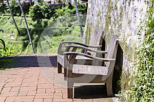 Two old wooden chairs in tropical garden for relaxing on nature , Island Bali, Indonesia. Closeup