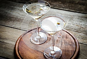 Two olive martini cocktails