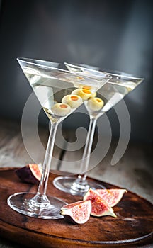 Two olive martini cocktails