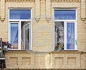 Two open windows in a town house