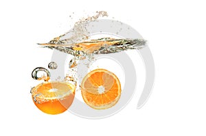 Two Orange fruits dropped into water splash on white background