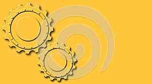 Two Orange Gears on Orange Background with Copy Space