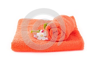 Two orange towels with apple flower