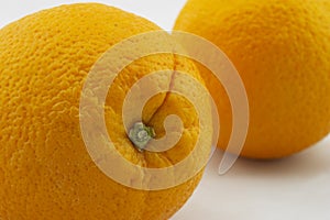 Two Oranges, closeup stem dimples