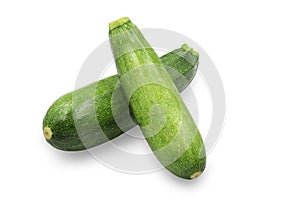 Two organic raw green zucchini or summer squash on white isolated background with clipping path. Zucchini have high vitamins and