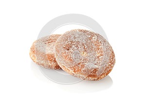 Two paczki donuts on white