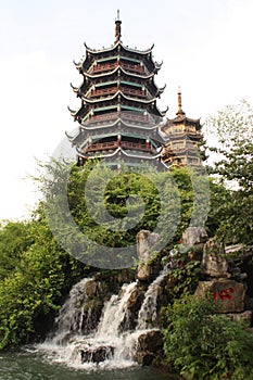 Two Pagodas and a waterfall in Guiling, China photo