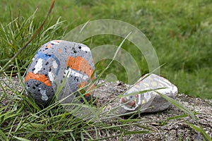 Painted stones in the grass