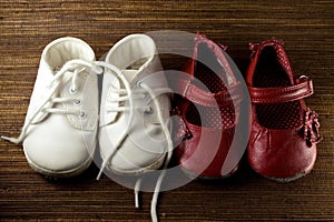 Two pairs of baby shoes photo