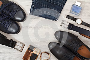 Two pairs of black leather men`s shoes, two belts for men, jeans