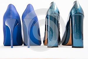 Two pairs of blue women's shoes. High-heeled shoes. One pair of thin heels, stiletto heels. The second pair has a stable