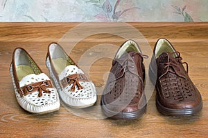 Two pairs of comfortable shoes : for men and for women.