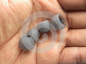 Two pairs of earphone pads on palm of hand