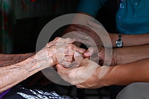 Two pairs of hand touch each other, together, helping hands