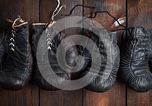 Two pairs of leather old boxing gloves