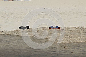 Two pairs of shoes on the beach Puerto Vallarta