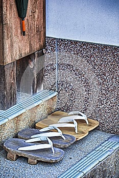 Two pairs of Traditional Japanese Sabot Sandals Near The Shrine Entrance on Mount Koyasan photo