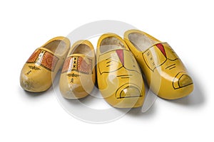 Two pairs of traditional yellow Dutch wooden shoes