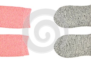 Two pairs of woolen socks, pink and gray, isolated on white