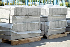 Two pallets with grey edgestone.