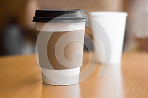 Two paper coffee cups