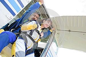 Two parachutists jumping out airplane in free style