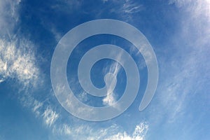 Two parallel clouds blue sky sun top .