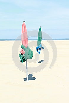 Two parasols on beach