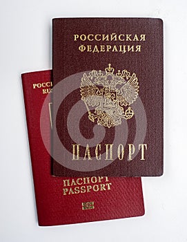 Two passports of the Russian Federation isolated on a white background. Passport for traveling abroad and domestic.