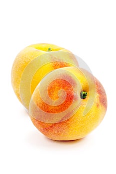 Two peach Isolated on a white background. Summer juicy fruit. Healthy food.