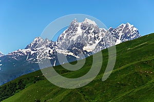 Two peaks of Mount Ushba. Main Caucasian Ridge.